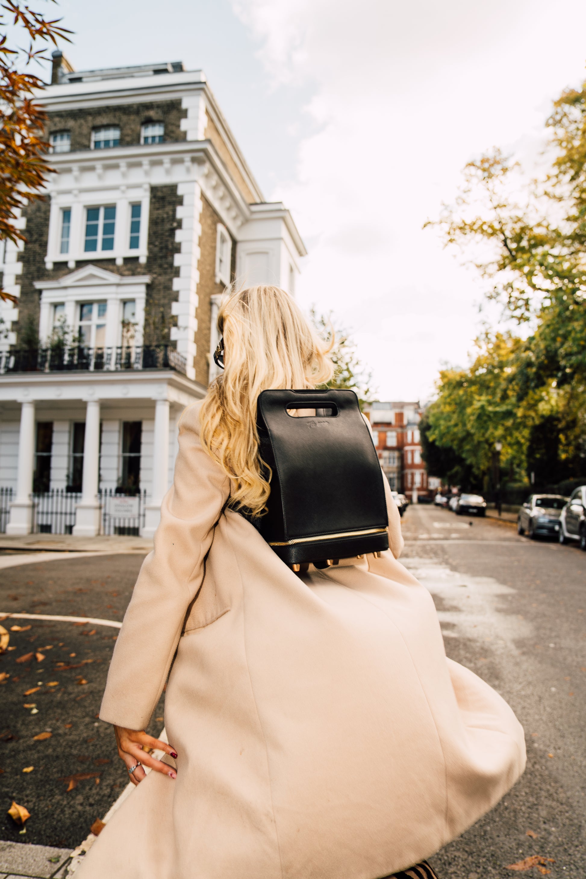walking behind wearing mini backpack