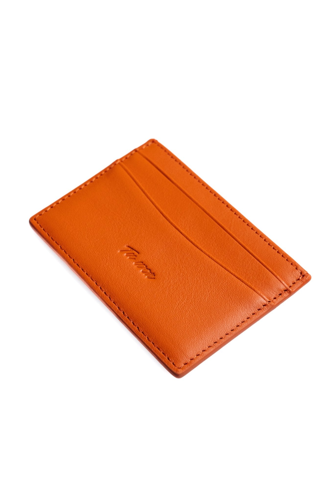 LNS orange close-up of Tuwon leather wallet showing premium material, stitching detail and refined craftsmanship finish