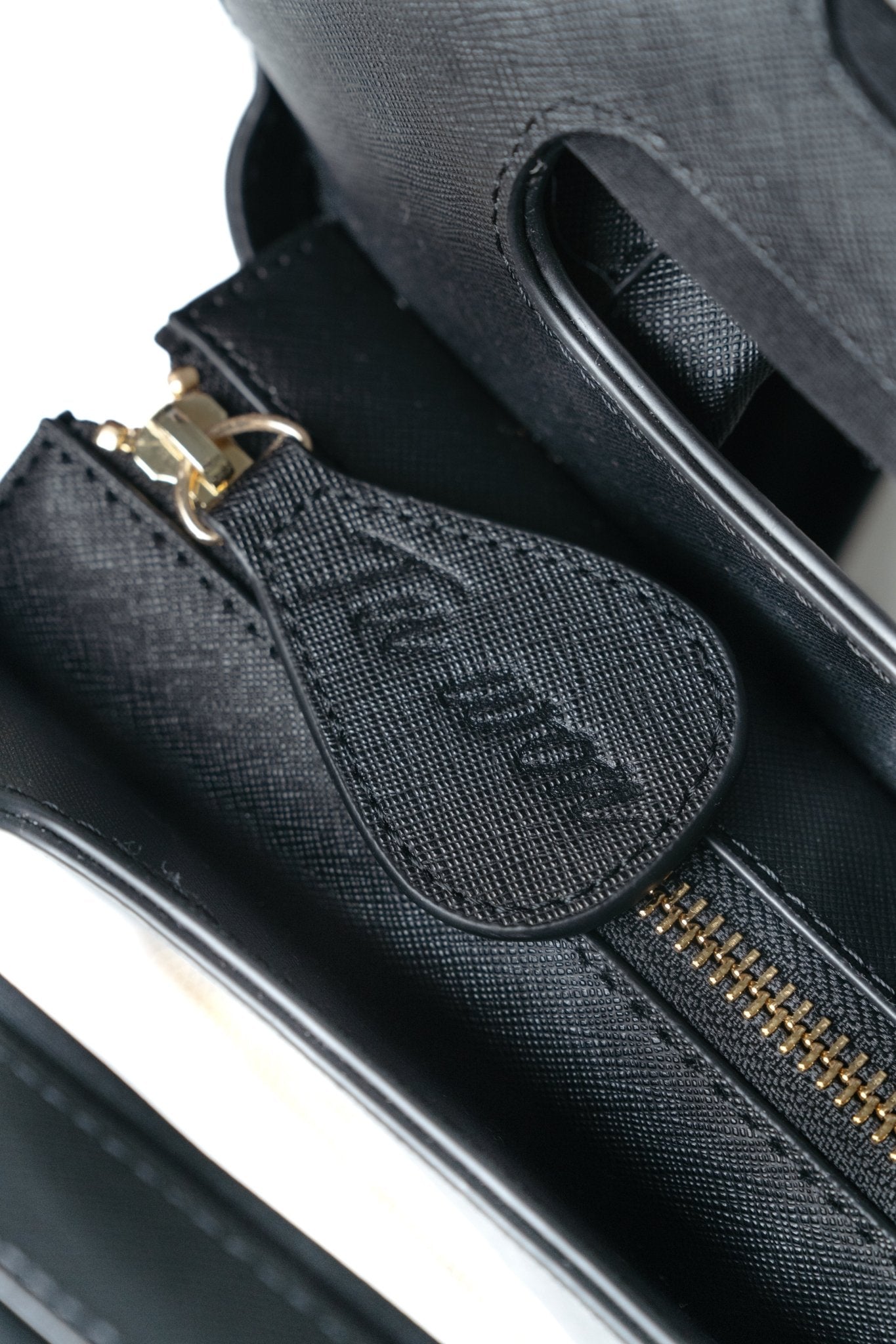 Close-up of Tuwon black leather backpack showing premium texture, stitching and high-quality craftsmanship detail