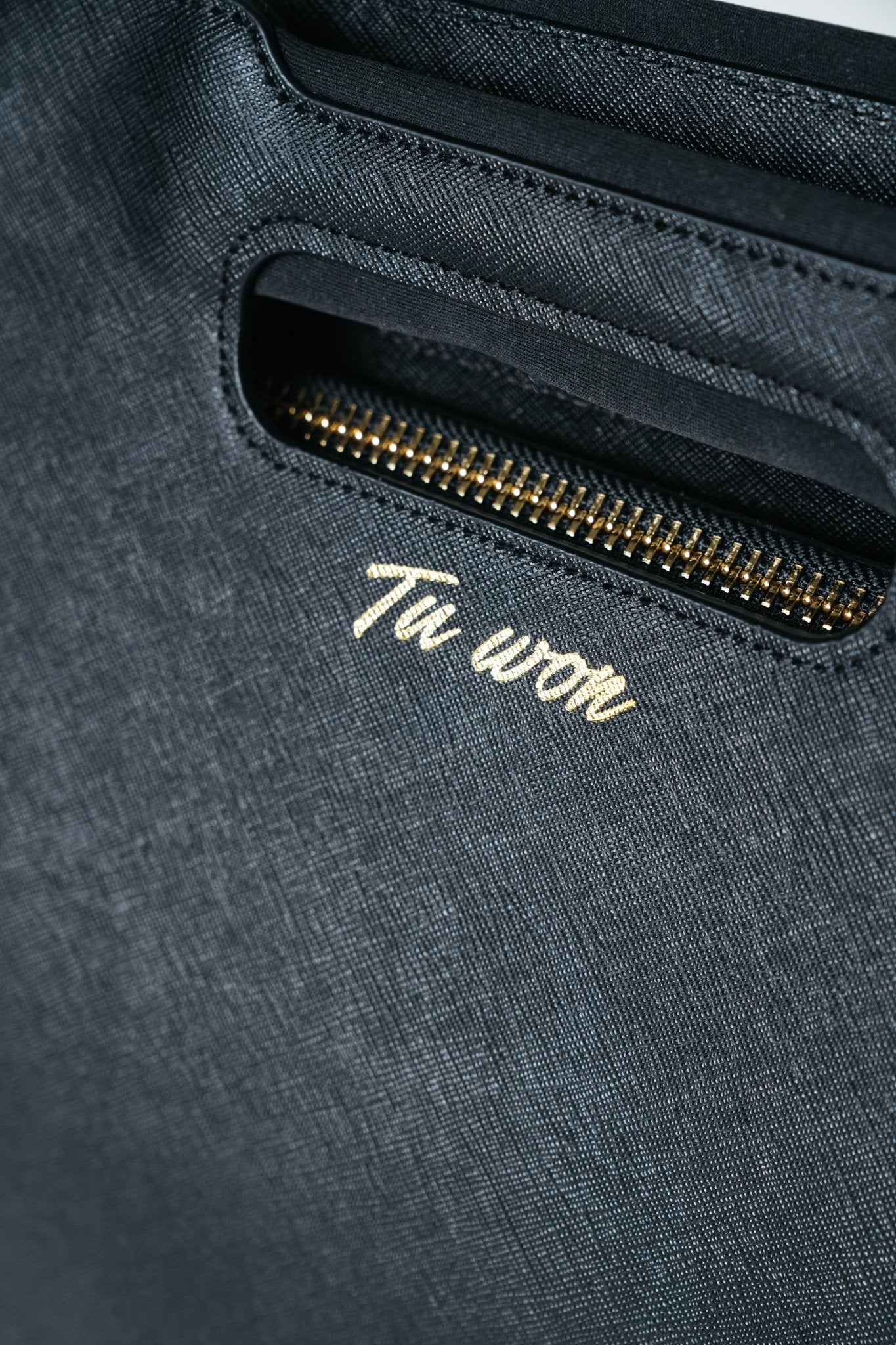 Close-up of Tuwon black leather backpack showing premium texture, stitching and high-quality craftsmanship detail
